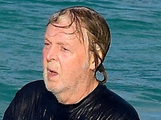 Paul McCartney, 81, enjoys a dip in the ocean as he heads to the beach with his wife Nancy, 64, during their Easter getaway to St Barts