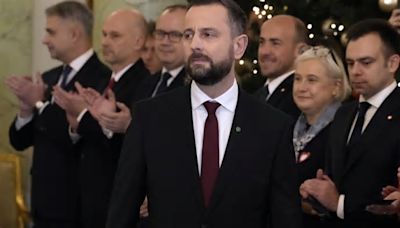 Polish defense minister fends off criticism after he says he keeps an emergency backpack ready