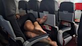 Passenger horrified by barefoot flyers snuggling on top of each other during flight