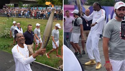 Watch rap legend Snoop Dogg dance with Olympics torch through streets of city