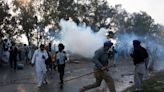 India security forces fire tear gas at protesting farmers on drive to Delhi