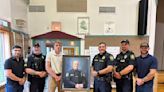 Portrait honors late Holden Police Chief Chris Greeley