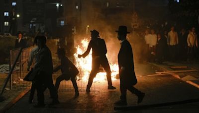 Ultra-orthodox protesters clash with police over military draft order in Jerusalem