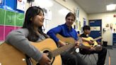 Guitar Donation Lifts Spirits Of Students In Flood-Ravaged Community