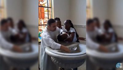 Vídeo: padre revolta família ao dar puxão em bebê durante batizado