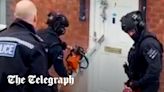 Police use chainsaw to cut through bemused grandfather’s front door in raid