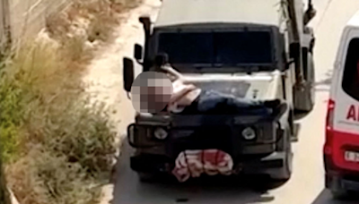 Israeli soldiers strapped injured Palestinian to jeep after West Bank arrest raid