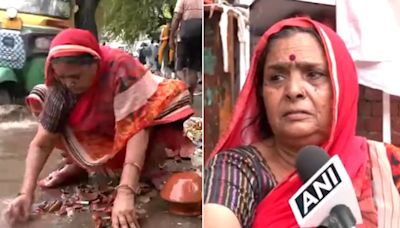 ...Delhi-NCR Rain Havoc: Heartbreaking Video Shows Elderly Woman Selling Pottery Items Collecting Pieces Of Broken Clay...