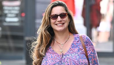 Kelly Brook turns heads in psychedelic mini dress and heels