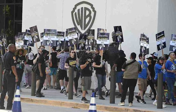 Striking video game performers protest unregulated AI use at Warner Bros. Studios in Burbank