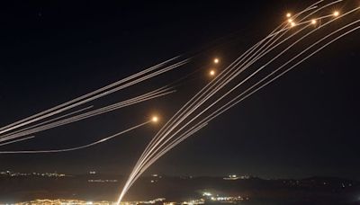 Video shows Israel's Iron Dome missile defense system intercepting Hezbollah rockets overnight as fears over wider conflict mount