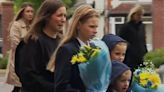 Rob Burrow's wife and children lay flowers at Headingley in teary tribute