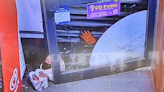 Armed robber foiled by brave shopkeeper who trapped him in roller shutters