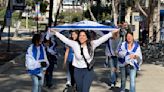 Large group of counterprotesters peacefully march outside pro-Palestinian encampment at UC San Diego