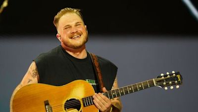 Thunderstorms couldn’t stop Zach Bryan from bringing the electricity to Gillette Stadium - The Boston Globe