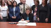 Gov. Kim Reynolds signs law consolidating Iowa's mental health system