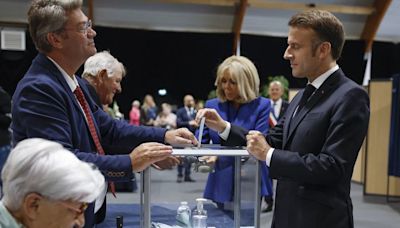 Macron urges new mainstream coalition, appearing to rule out working with the far left