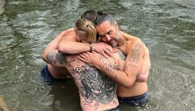 Russell Brand shares new picture embracing Bear Grylls during River Thames baptism