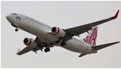 Naked passenger knocks down crew member on Melbourne-bound Virgin Australia flight, arrested