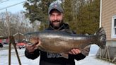 Fisherman finagles record rainbow trout through tiny hole in ice