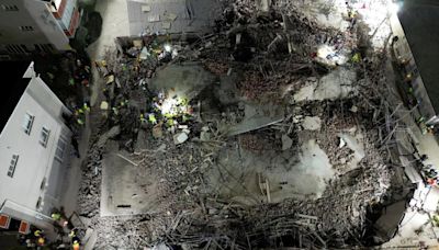 Rescuers cheer as survivor pulled from rubble 5 days after building collapse