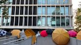 Protesters at Cal State L.A. created a barrier including large umbrellas as they occupied the student services building on campus Wednesday.