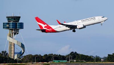 Qantas agrees to pay $79 million in compensation and a fine for selling seats on canceled flights