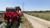 Floral tributes left at scene where dog walker was attacked in village