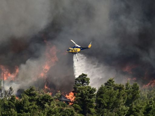 Residents flee as wildfire rages uncontrolled near Athens