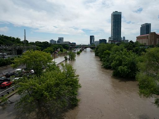 A major highway and roads are flooded as torrential rains hit Canada’s largest city