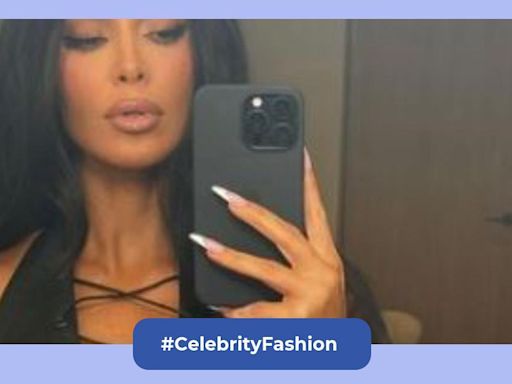 Kim Kardashian just posted her hottest photos in a leather tie-front top while icing her back