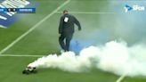 Remote control cars with flares invade pitch during match in Germany