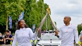 France's Thierry Henry and Romane Dicko carry Olympic flame through Paris on Bastille Day, calling the experience "extraordinary"