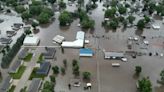 Rail bridge collapses during Midwest flooding as a heat wave persists across much of the US