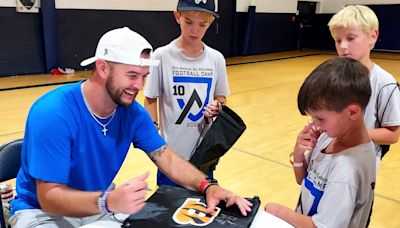 Ankle surgery doesn’t slow AJ McCarron at annual free football camp