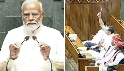 ...Rahul Gandhi Shows Copy Of Constitution To PM Modi As He Takes Oath As Member Of 18th Lok Sabha Amid...