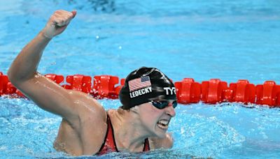Superstars Marchand and Ledecky light up Olympic pool