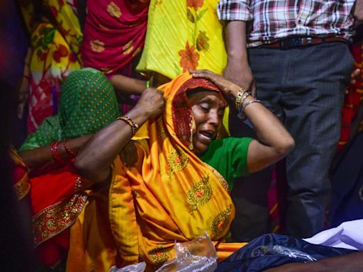 Six organisers arrested after crush at religious event in India kills 121
