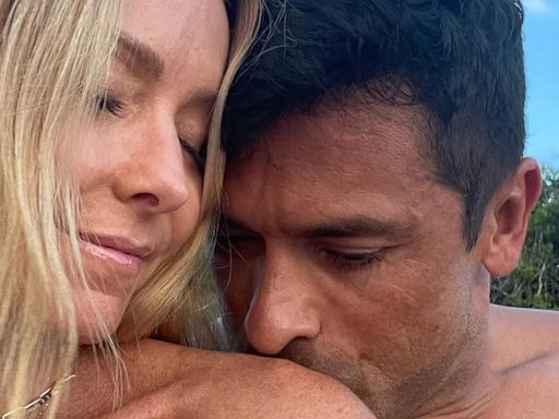 Shirtless Mark Consuelos kisses Kelly Ripa’s bare shoulder in beach pic