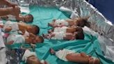 Tin foil used to keep babies alive with incubators losing power at Gaza hospital – as tanks surround outside