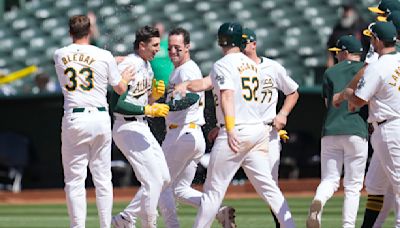 A's hit 2 tying homers in late innings and score 5 runs in 11th to rally past Rockies 10-9