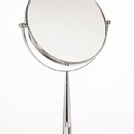 Typically smaller mirrors placed on a makeup table or vanity. Often equipped with lighting for optimal visibility during grooming.