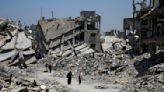 Bodies trapped in Gaza City under Israeli assault as mediators push for truce