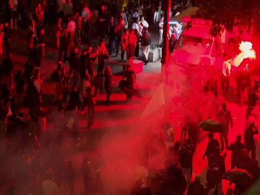 Tear gas and riot police deployed against crowds gathering at Paris landmark after French election results