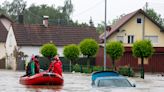 A firefighter dies and a long-distance train derails amid heavy rains and flooding in Germany