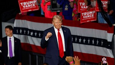 Trump attacks Harris on immigration in first rally since Biden bowed out