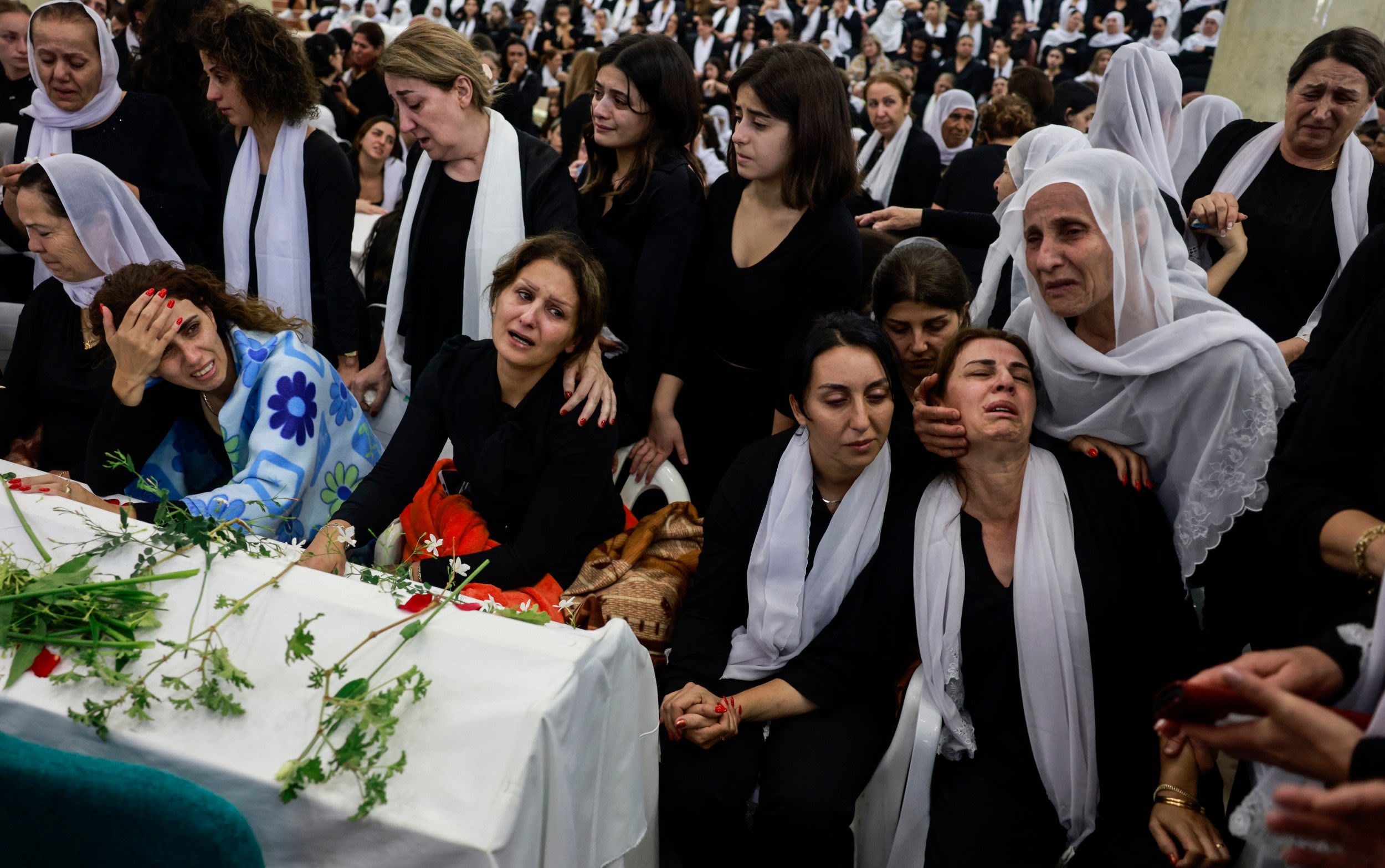 Mourners heckle Israeli ministers at funerals of 12 children killed by Hezbollah rockets