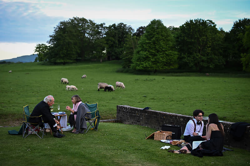 Music lovers enjoy opera and picnics with the sheep at Glyndebourne