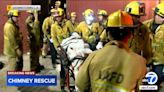 Firefighters rescue man stuck in chimney of abandoned building in downtown LA