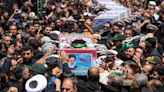Iran begins burying late president, foreign minister and others killed in helicopter crash